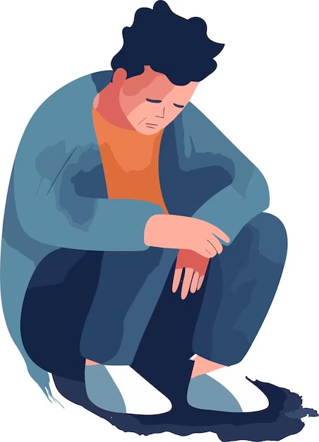 Person crouching with head looking down and feeling despair 